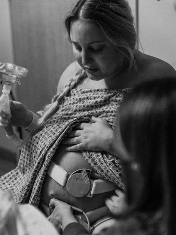 Mom during her labor and delivery at HealthPark Medical Center in Fort Myers Florida before giving birth to her baby captured by southwest Florida birth photogrpher, Ella Rae Photography